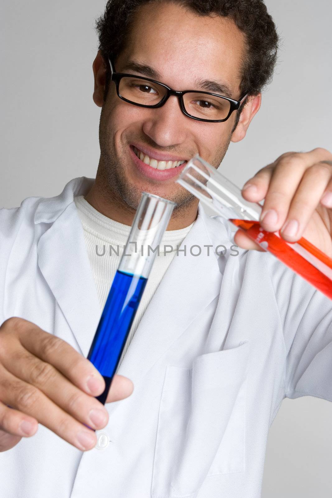 Man pouring liquid from test tubes