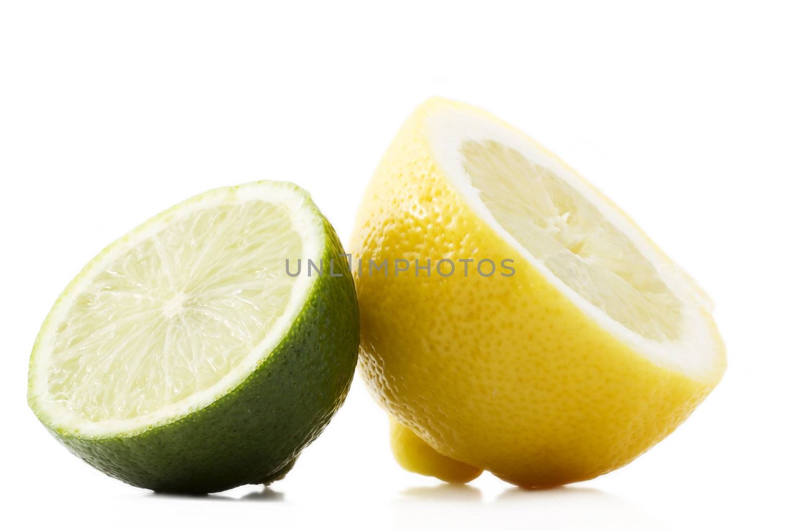 one half lemon and half lime on white background