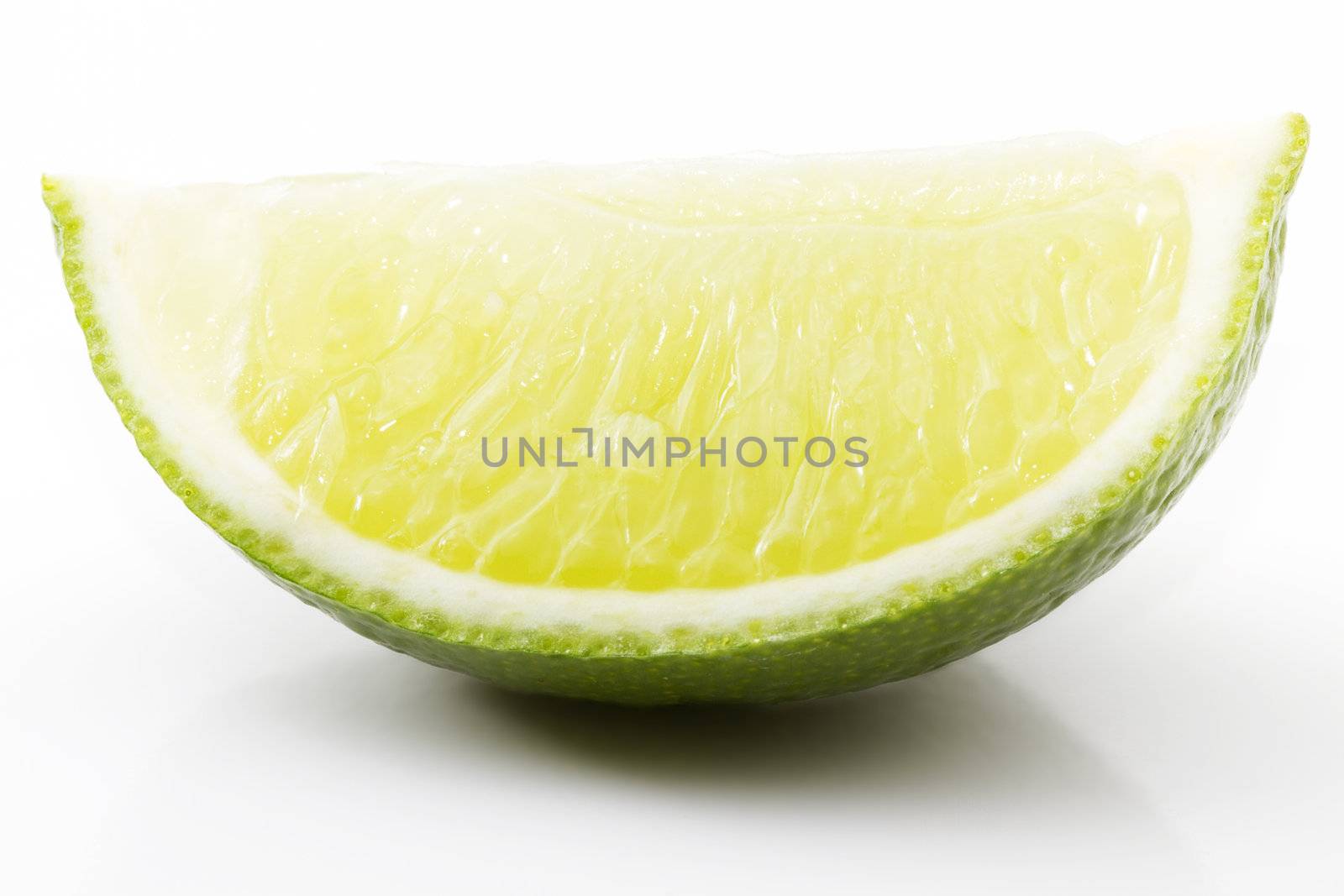 on piece of lime on white background