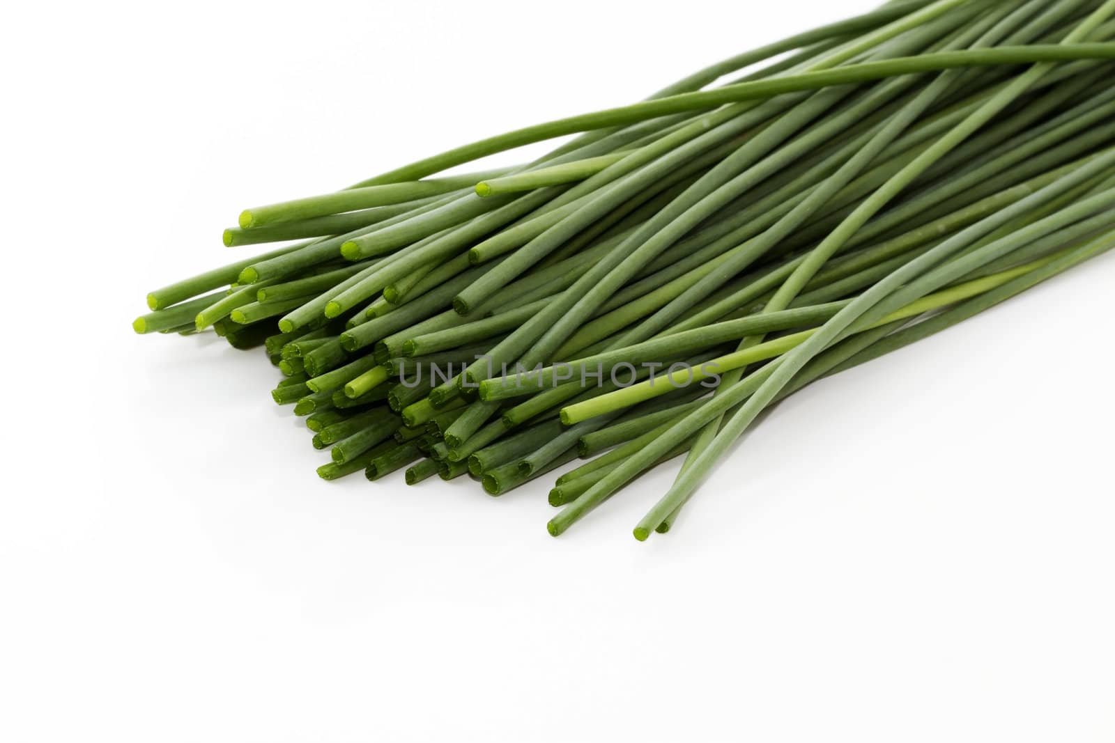 some cutted chive bottoms on white background