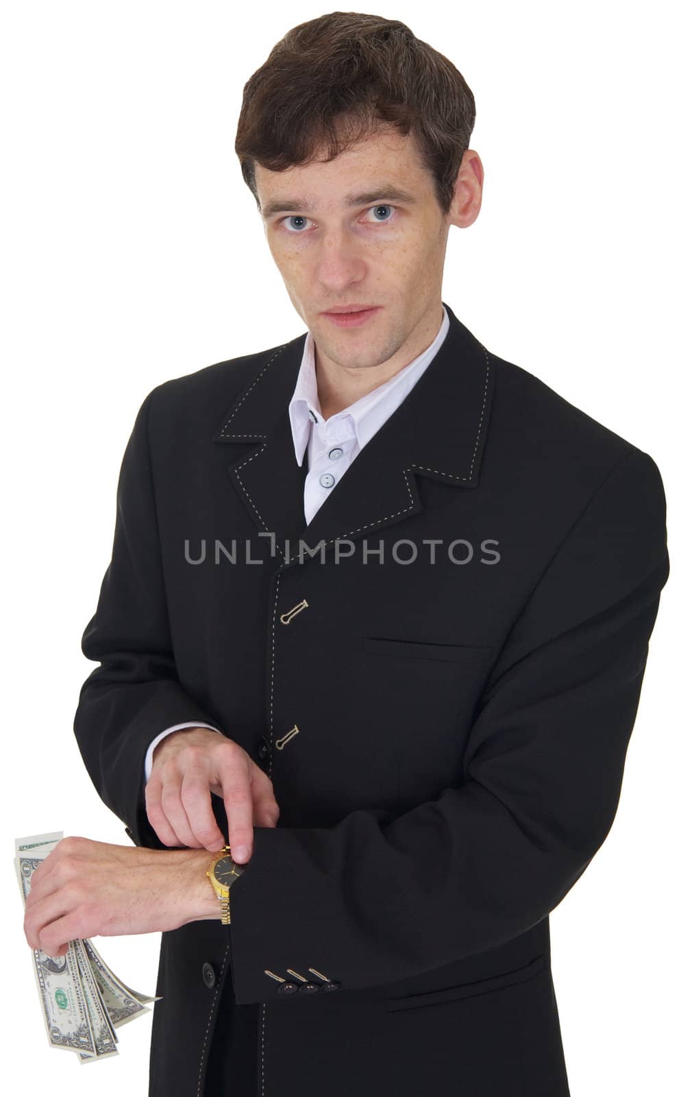 The man in a business suit with a pack of dollars in a hand shows on watch