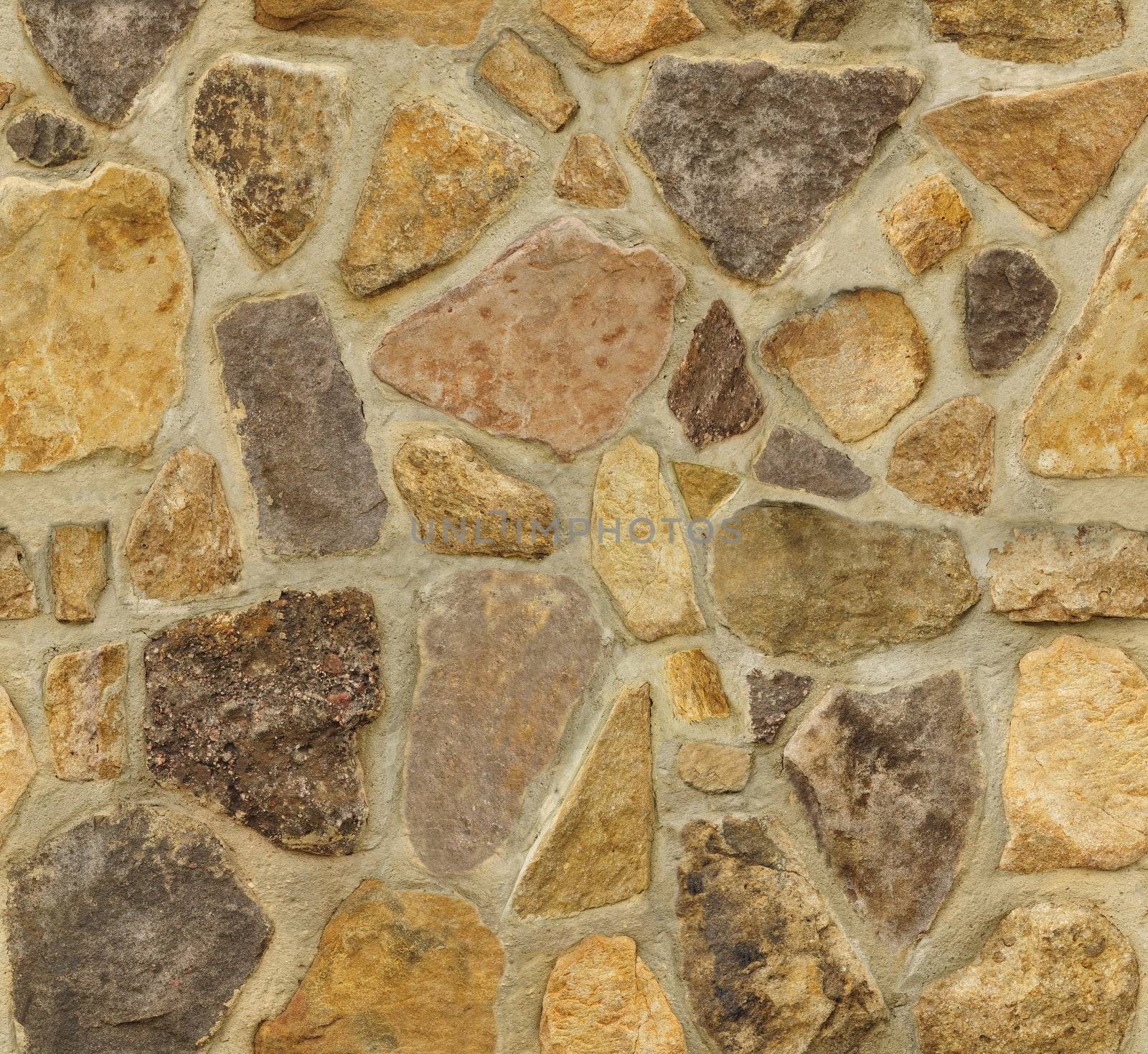 Seamless masonry wall with irregular shaped stones. The texture repeats seamlessly both vertically and horizontally.