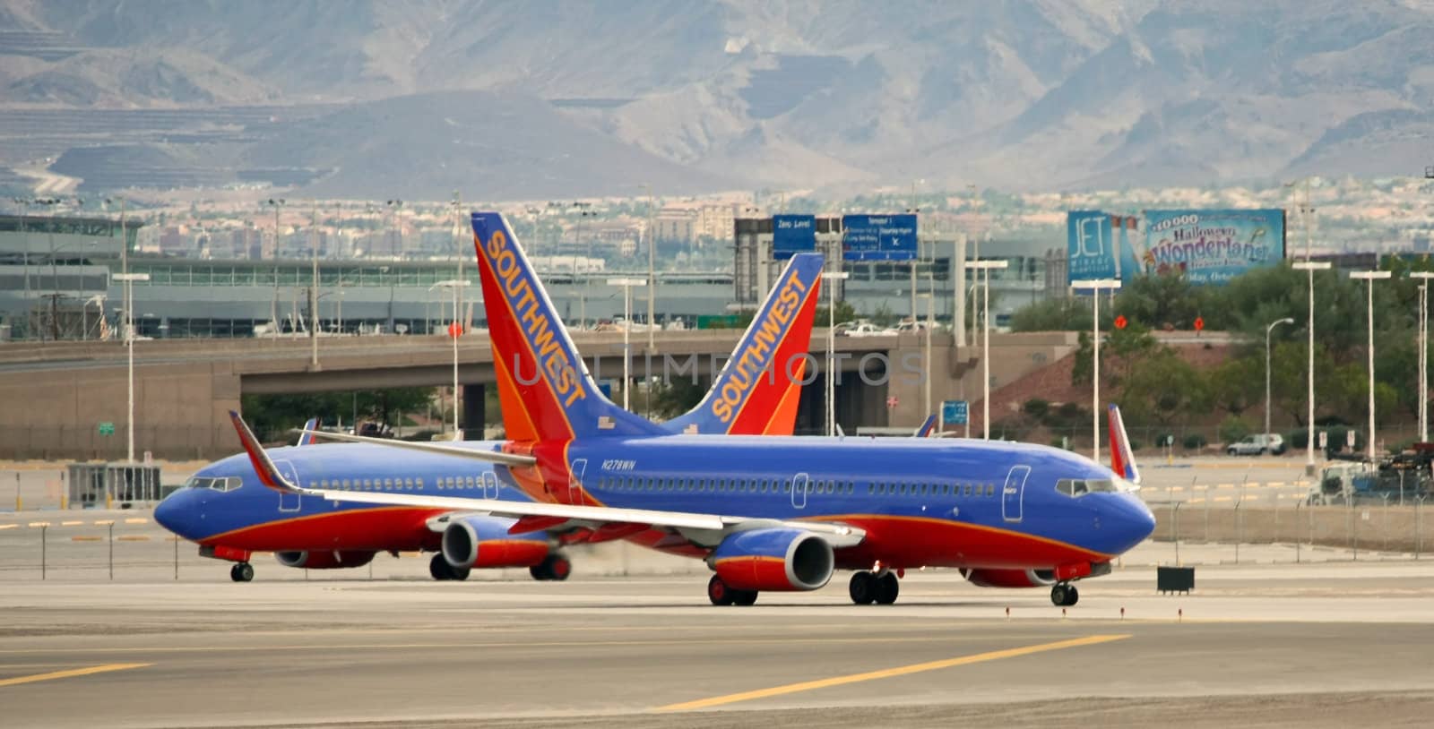 LAS VEGAS - OCT 31: Taken in Las Vegas, Nevada at McCarran Airport on Friday, October, 31, 2008. Two Southwest Airlines pass each other on the tarmac before take off.
