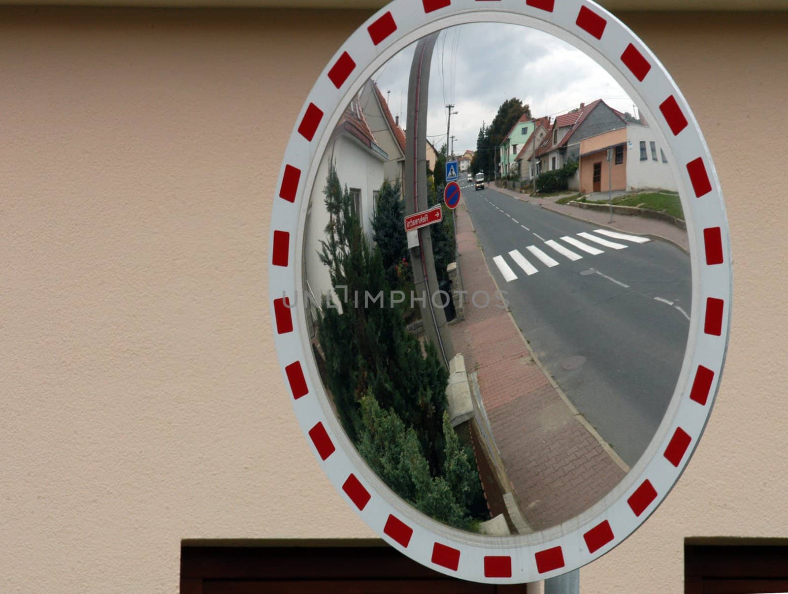 Mirror by the road for drivers to see behind the corner