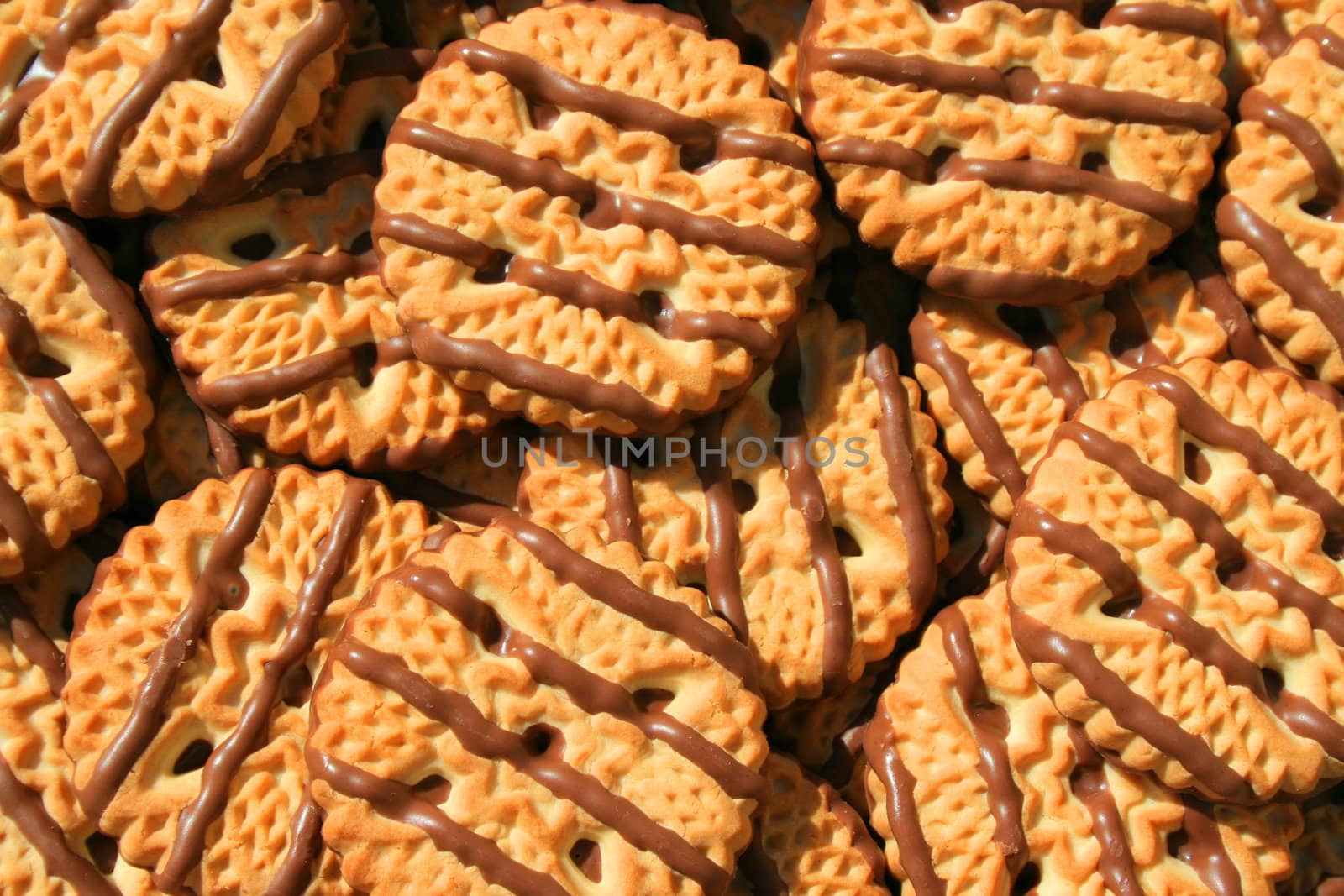 Close up of chocolate striped shortbread cookies.
