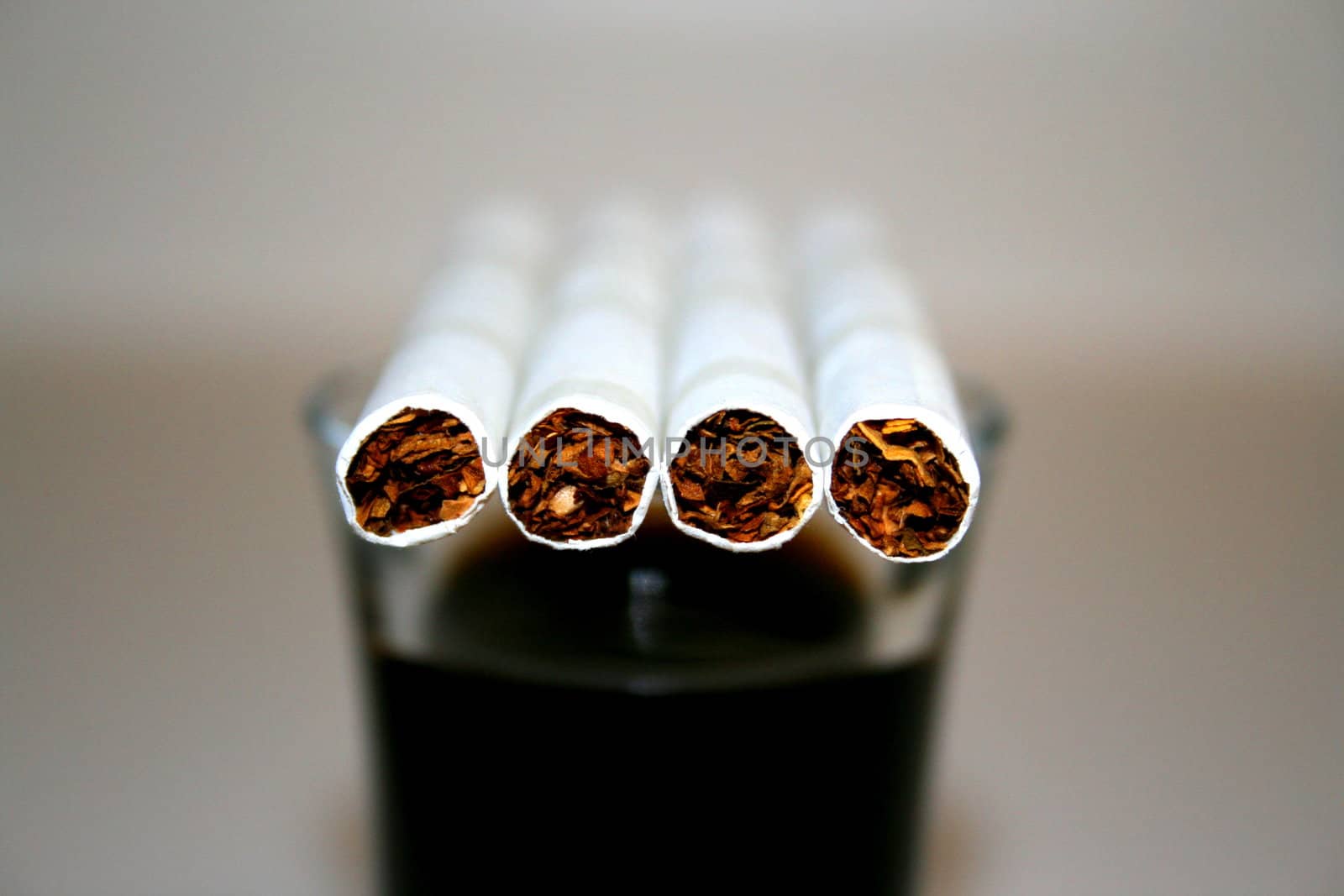 Cigarettes on a Glass by MichaelFelix