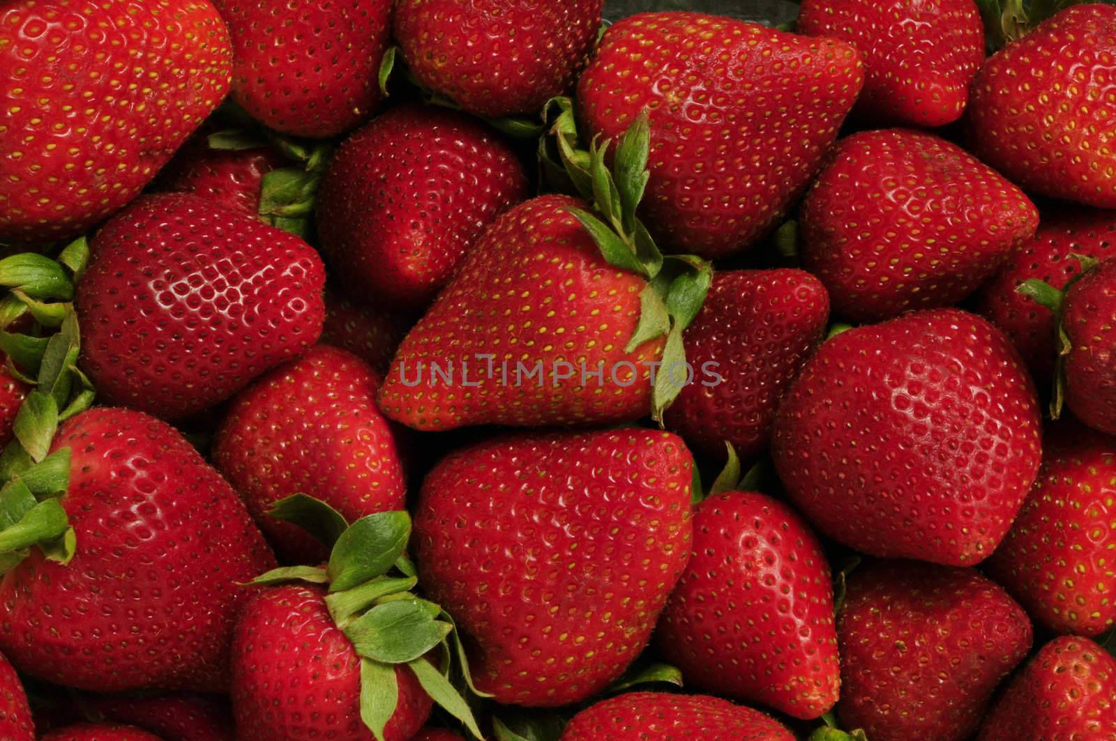 Pile of red strawberries filling frame