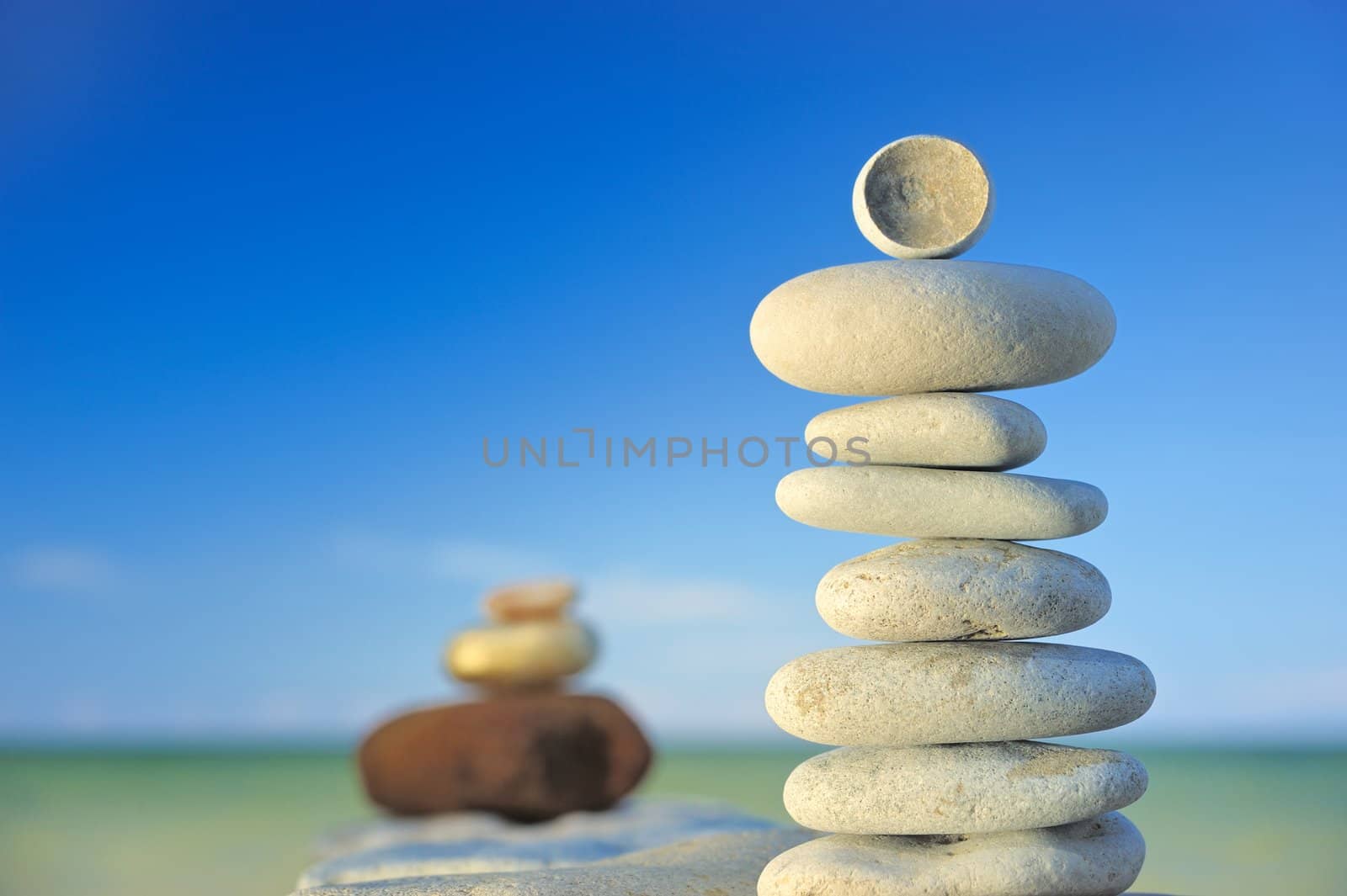 Stones on a beach in the evening by styf22