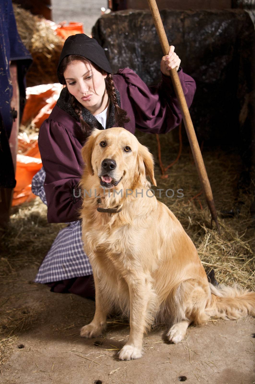 Pretty girl at a farm with her dog (focus is on dog)