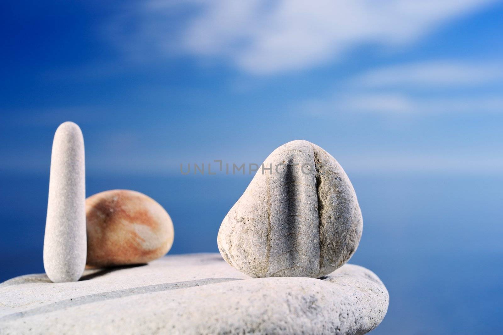 Pebble against the blue sky by styf22