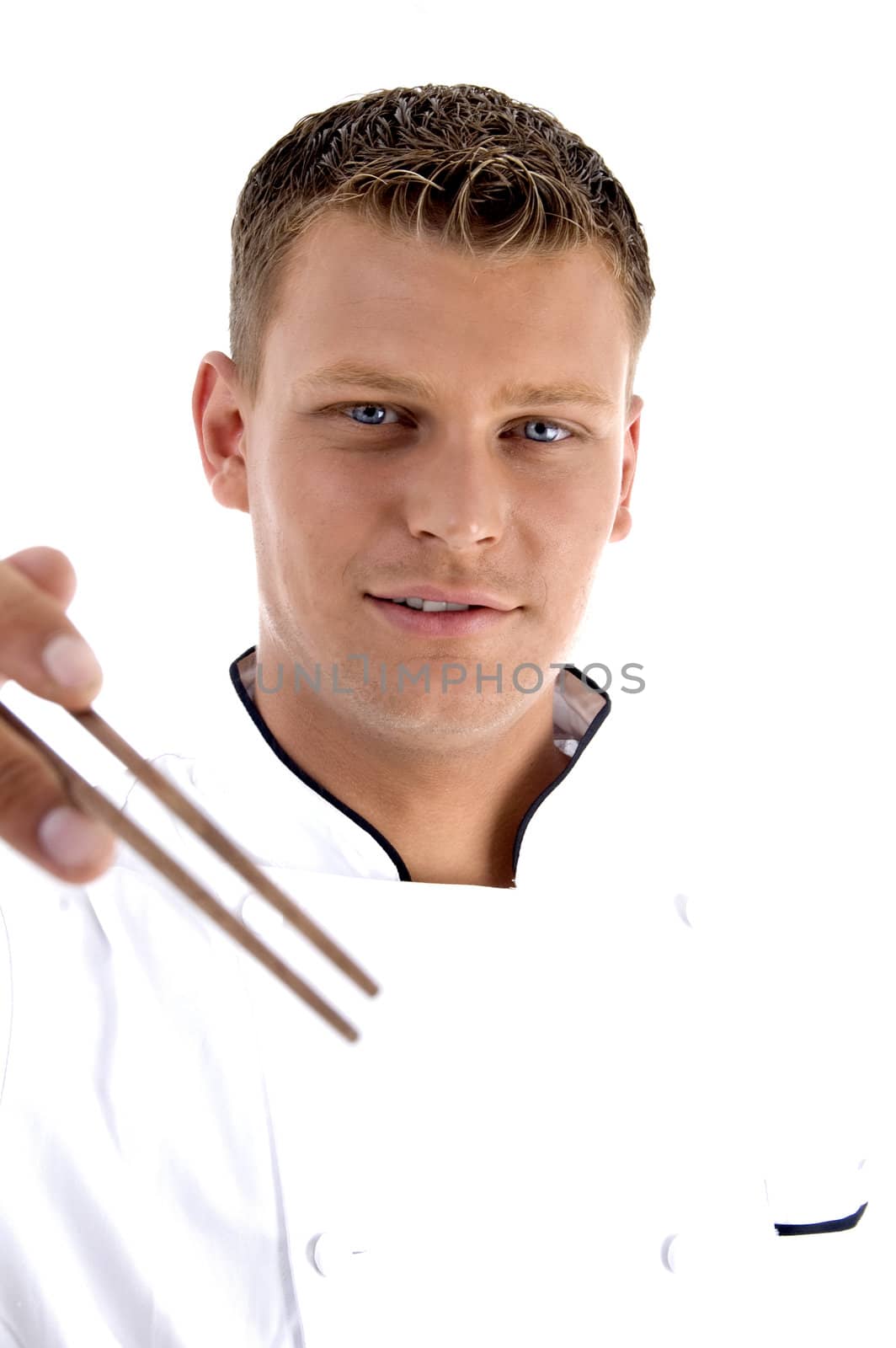 handsome chef holding chopsticks on an isolated white background