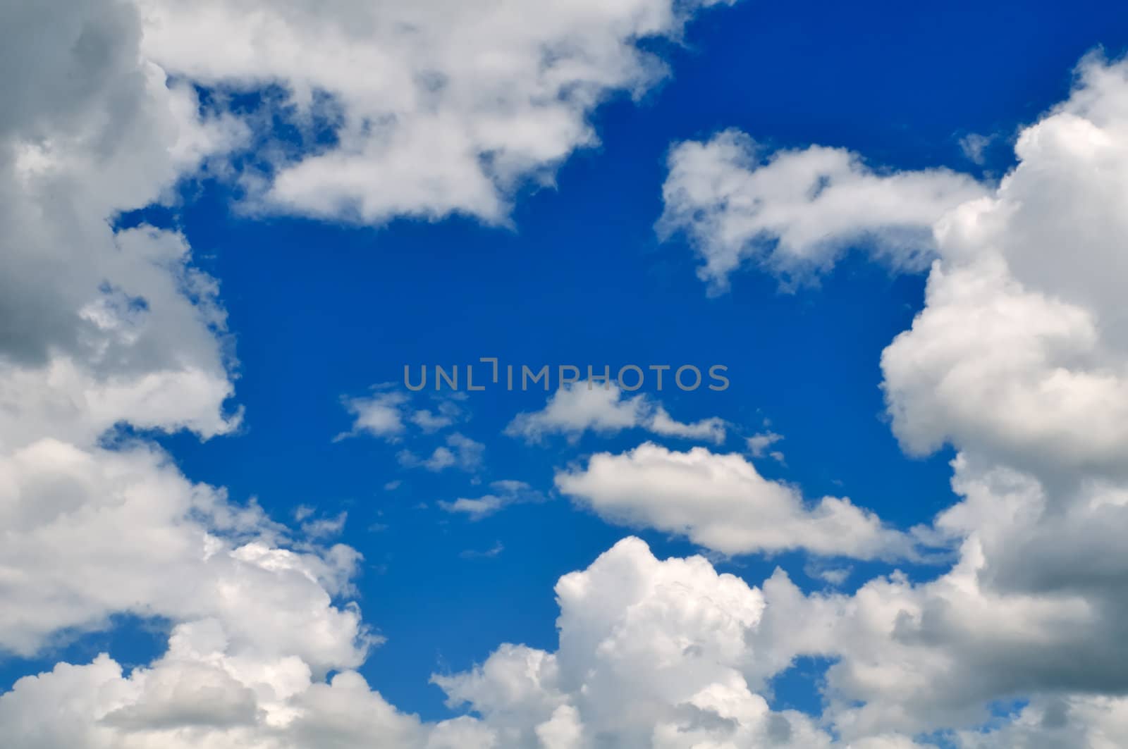 Deep blue sky with clouds