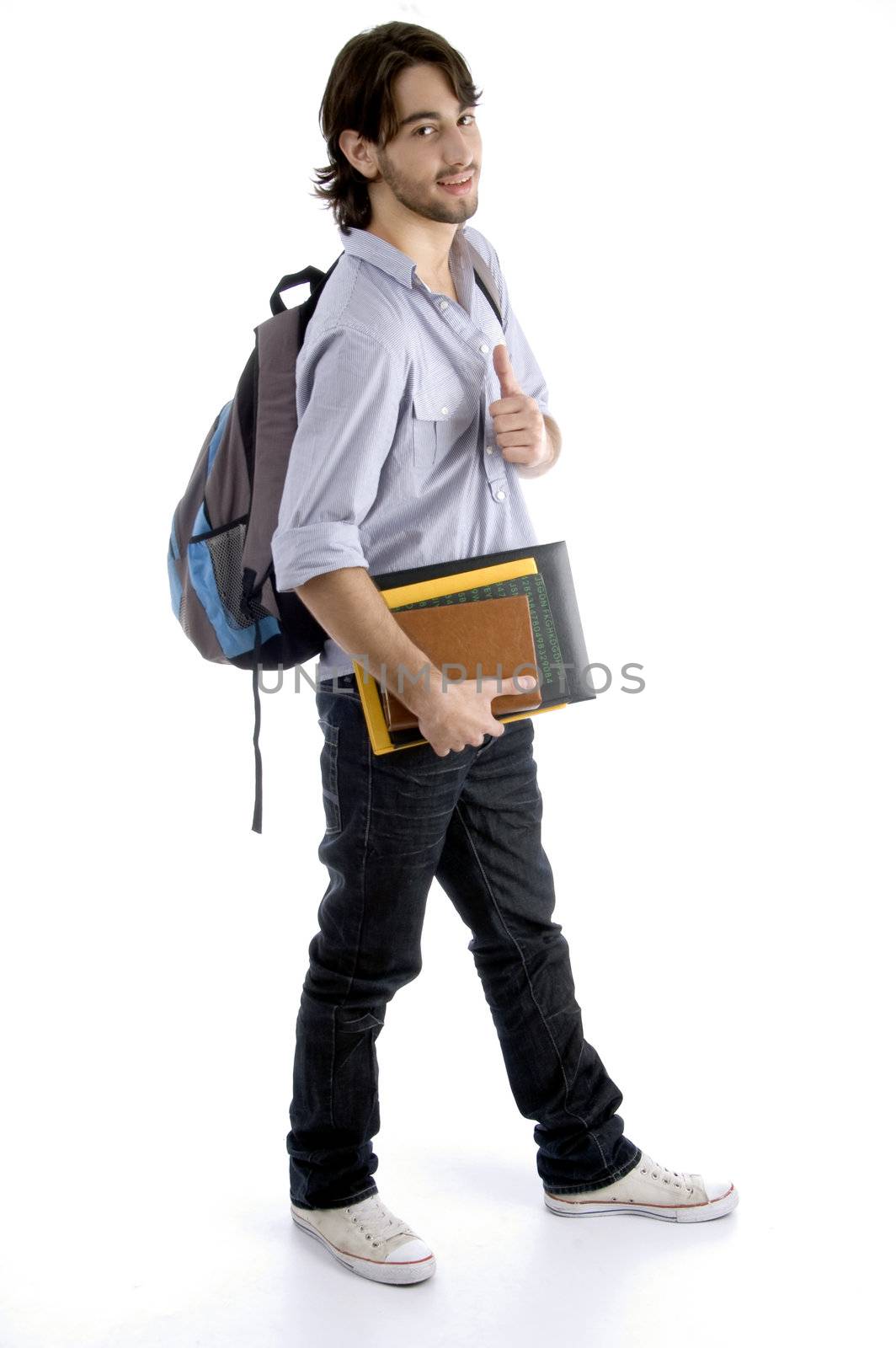 full body pose of student holding his books with white background
