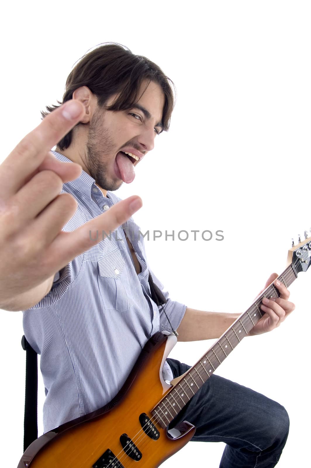 young rock star posing with guitar isolated on white background
