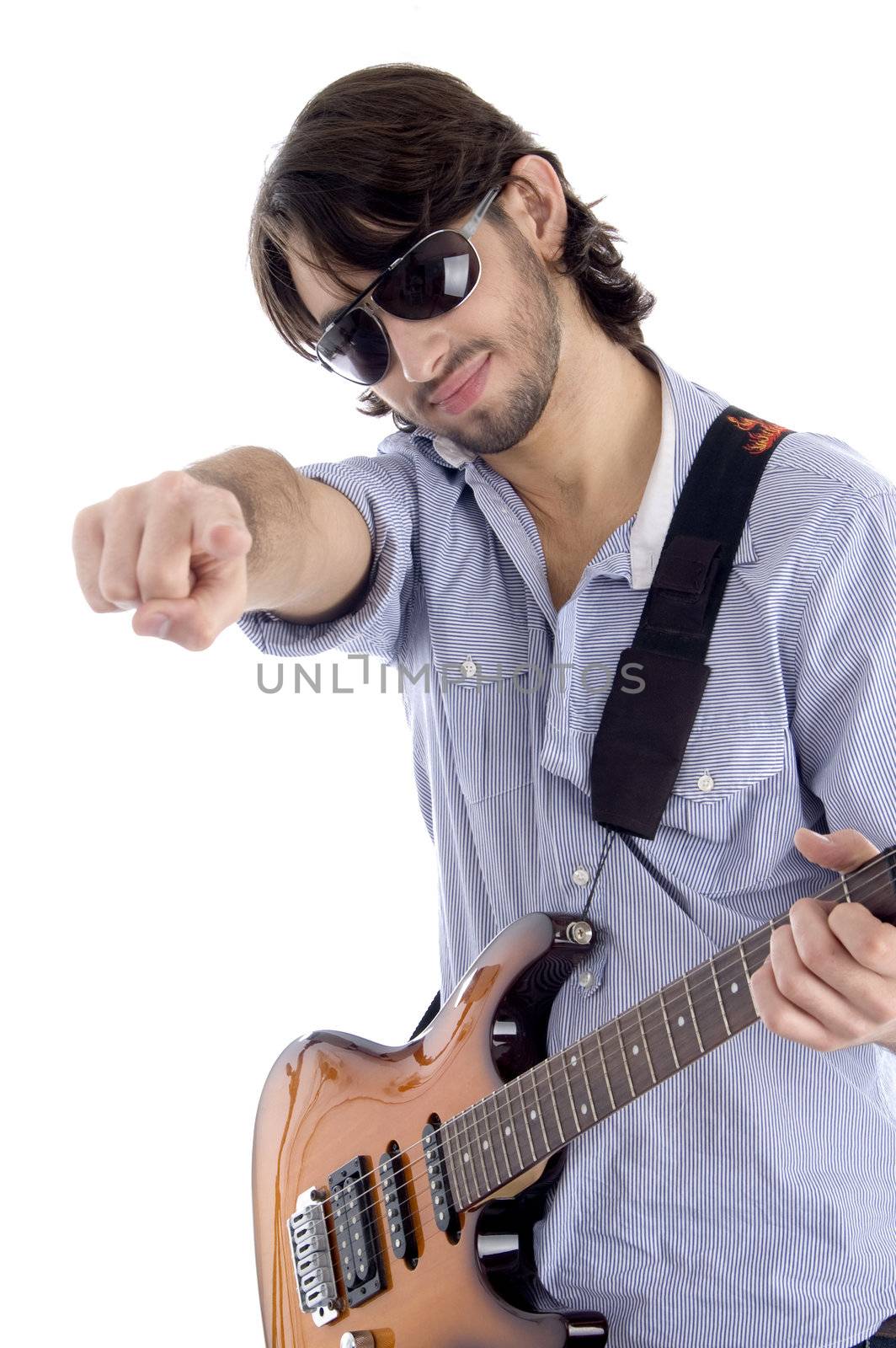 young guitarist with pointing finger against white background