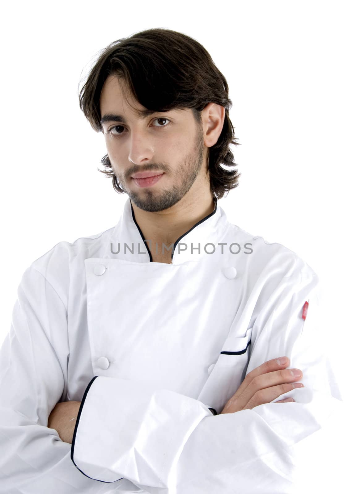 young chef posing with his arms crossed isolated on white background