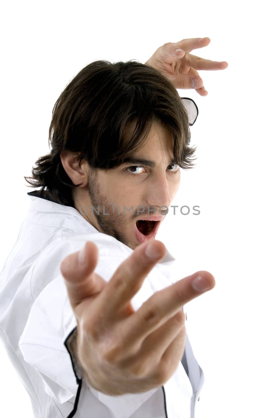 man in chef uniform performing karate stance on an isolated white background