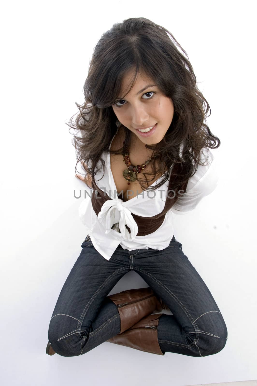 sexy teenager sitting on floor with legs crossed with white background