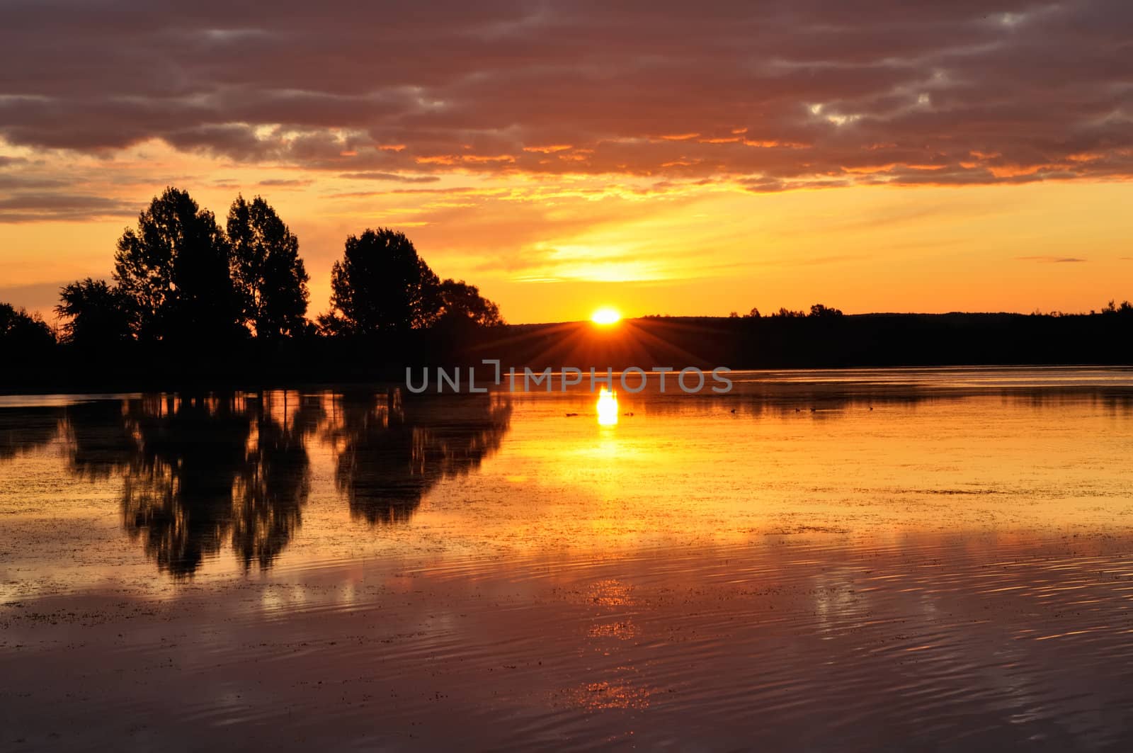 Sunrise on a lake by Hbak