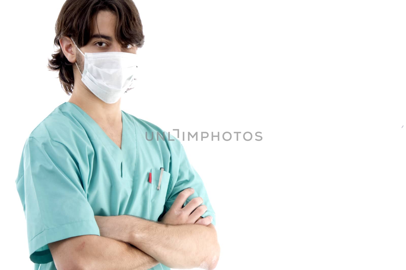 young surgeon posing with crossed arms on an isolated white background