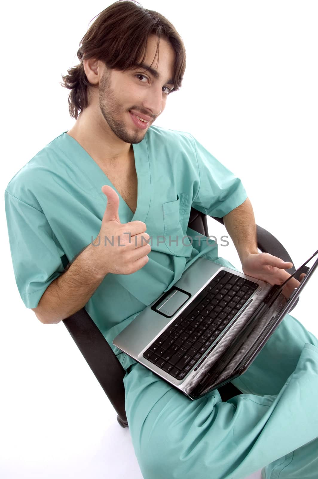 doctor working on laptop wishing goodluck against white background