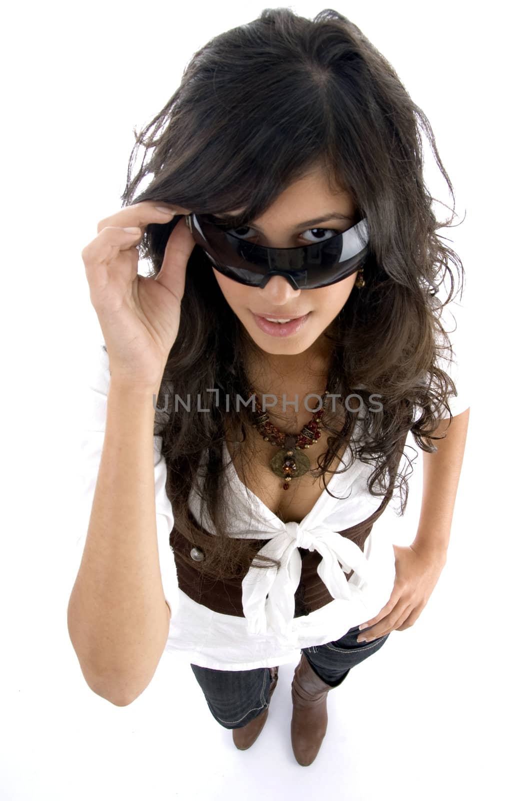 teenager peeping through sunglasses with white background