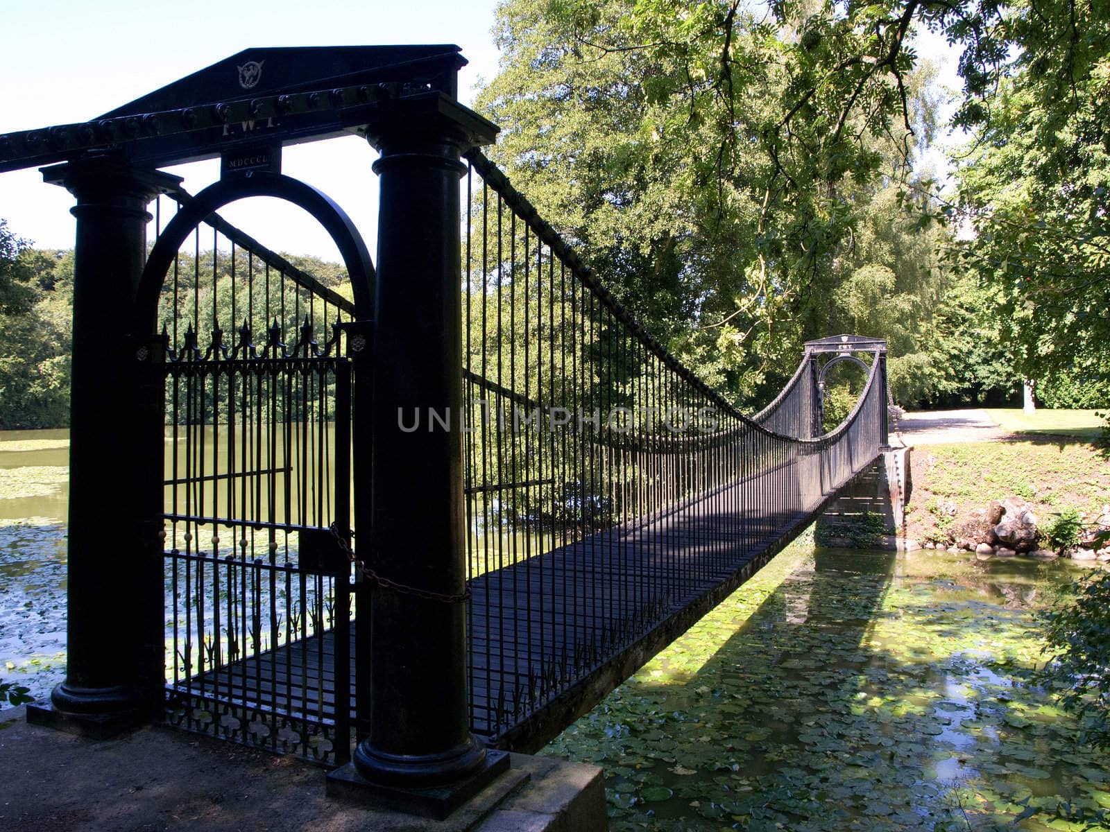 Old Steel footbridge in a country estate Denmark