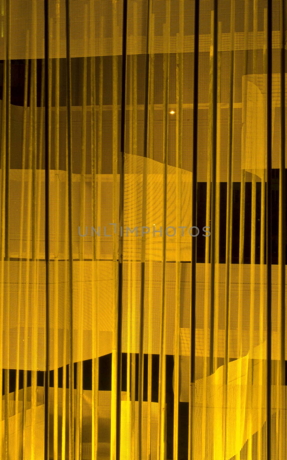 closeup of a yellow illuminated structure at night