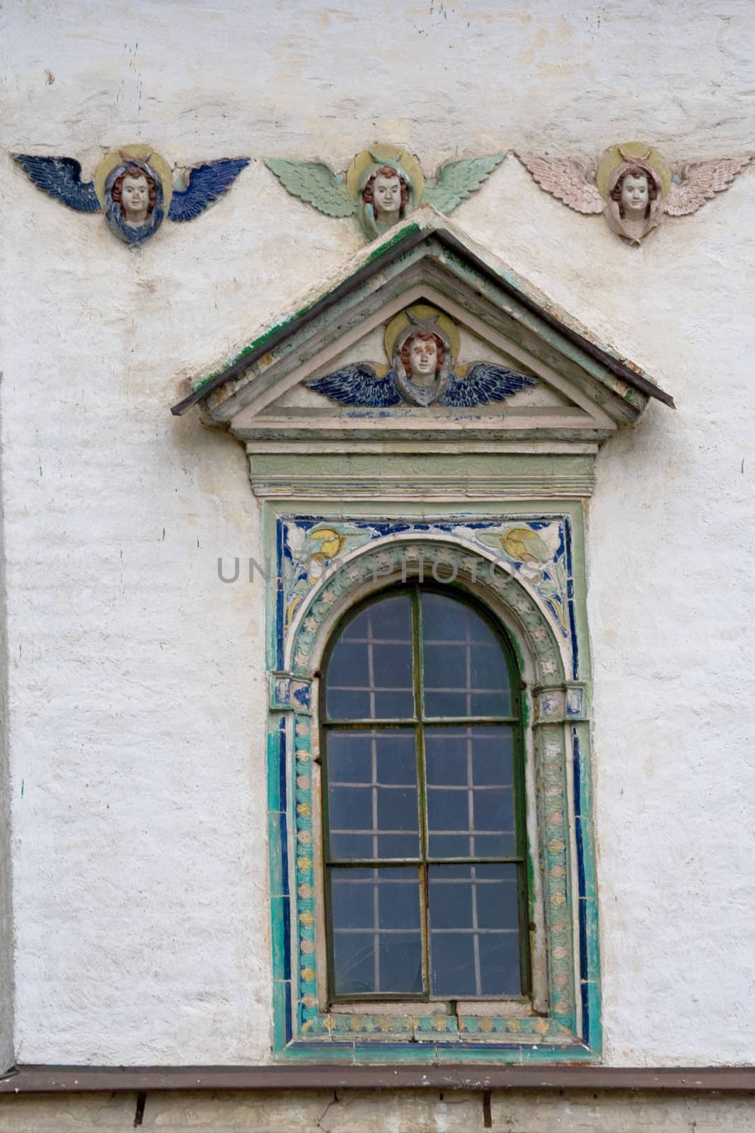Old baroque window with four angels
