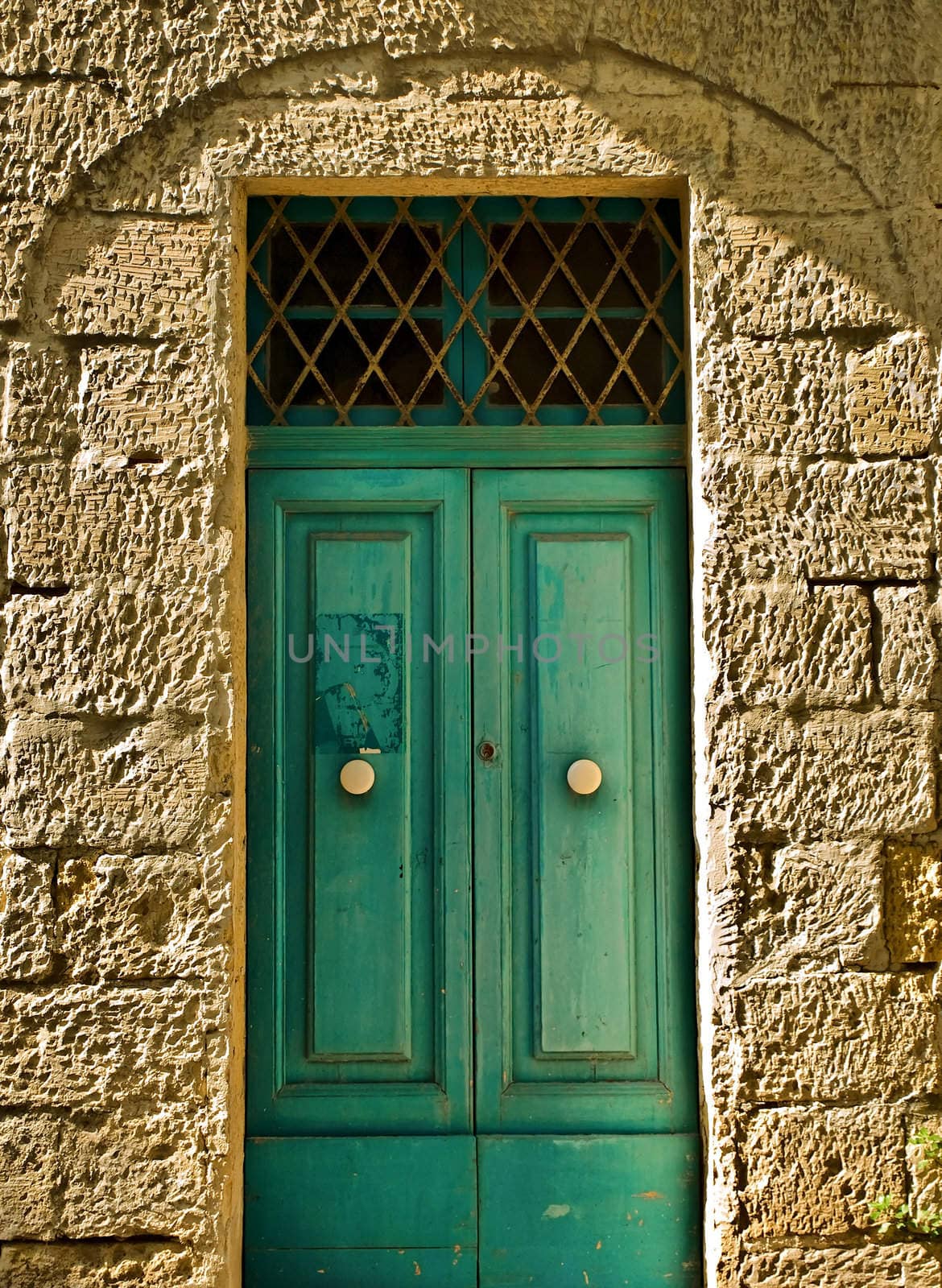 Typical Maltese traditional door in aquamarine colour