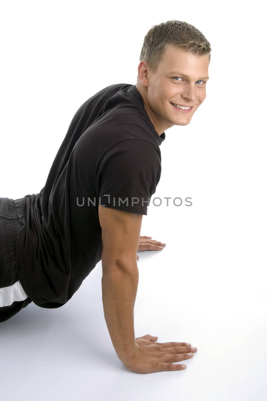 muscular man doing push ups on an isolated background