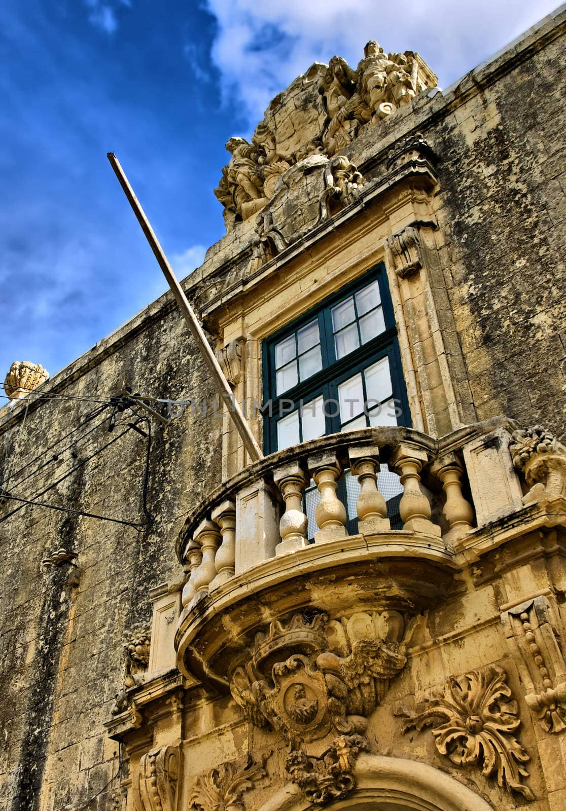 Typical features on a facade of a baroque house in Malta 