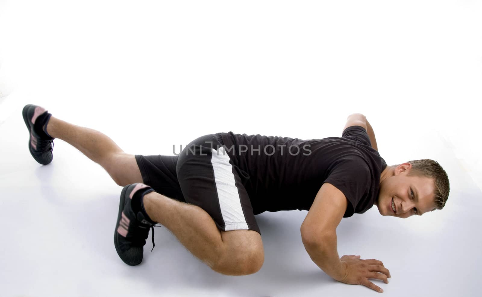 muscular male doing push ups on an isolated white background