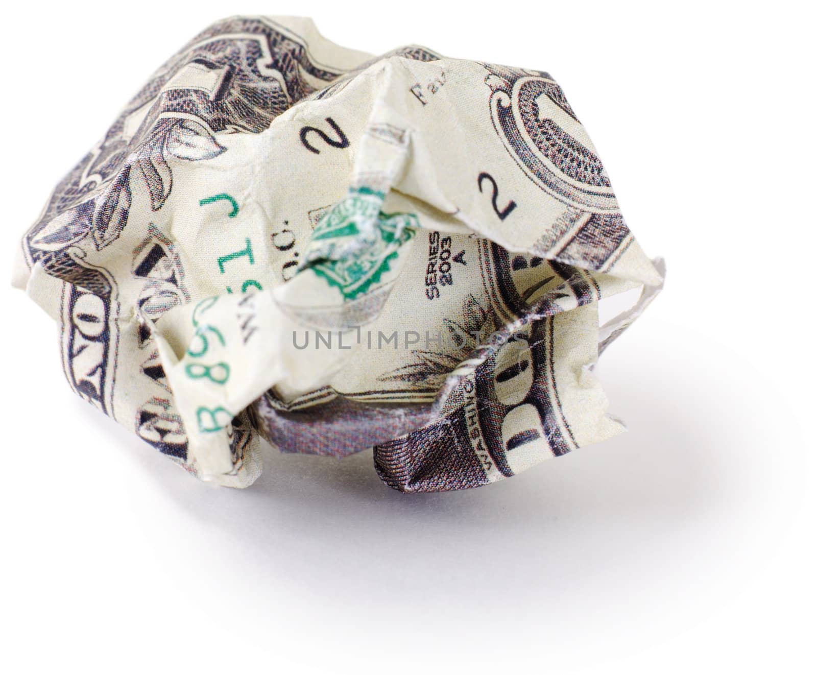 Crumpled dollar photographed on a white background