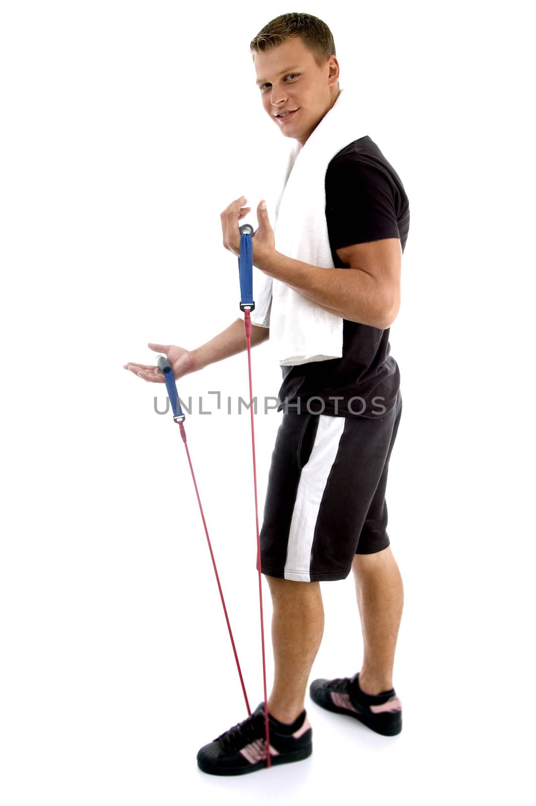 exercising man holding rope against white background