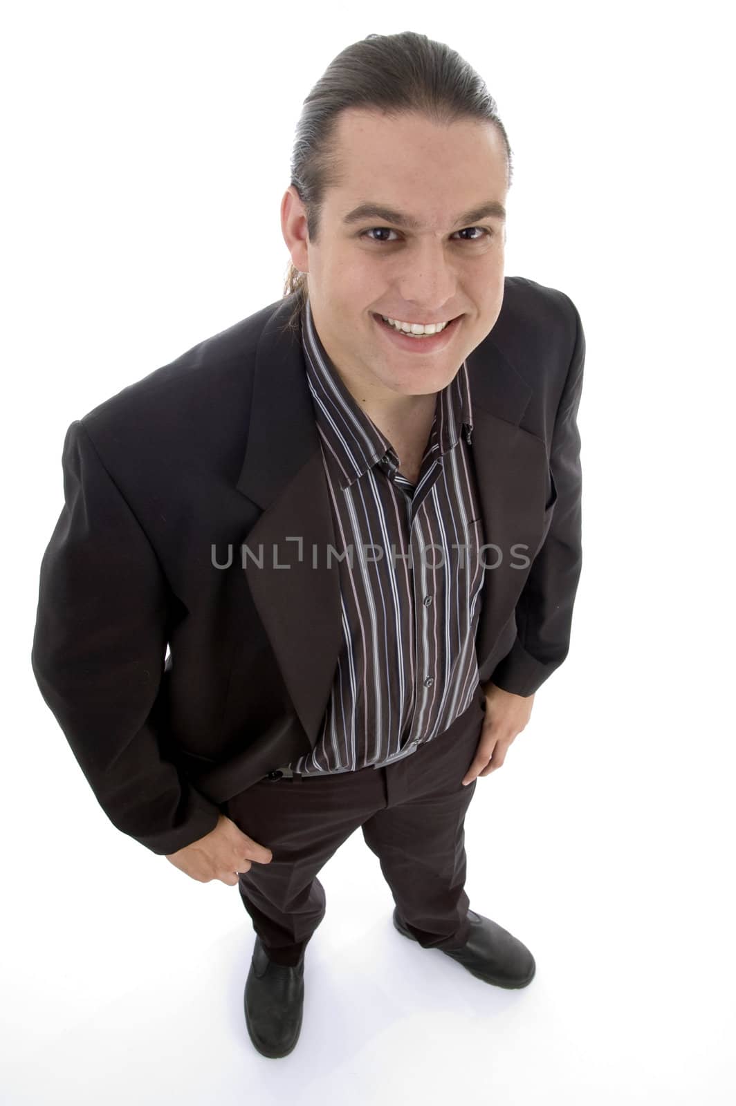 smiling man looking upward against white background