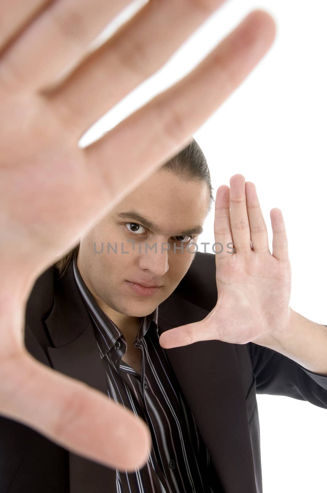 businessman holding hands like frame on an isolated white background