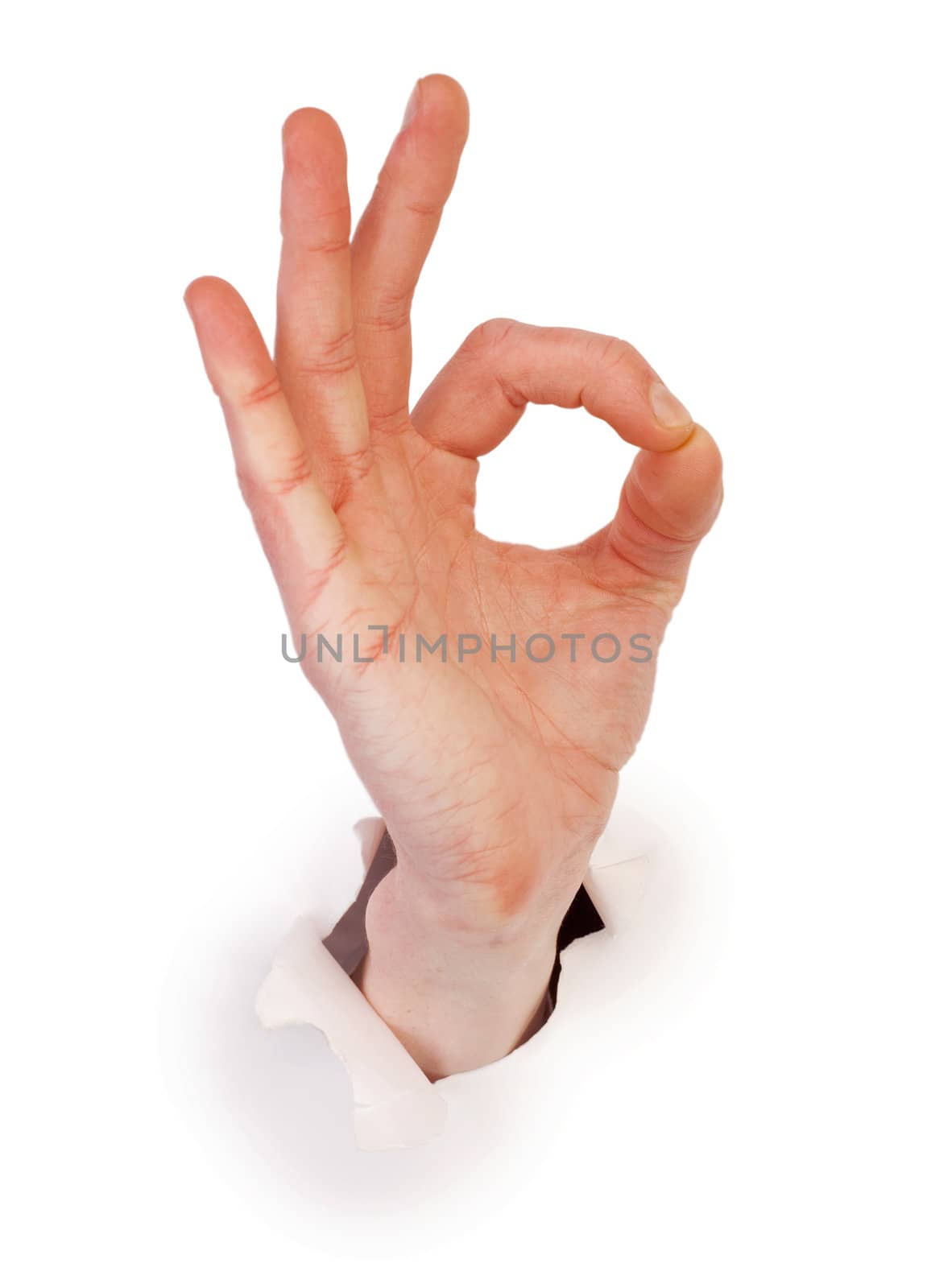 Gesture male hand through white paper photographed on a white background