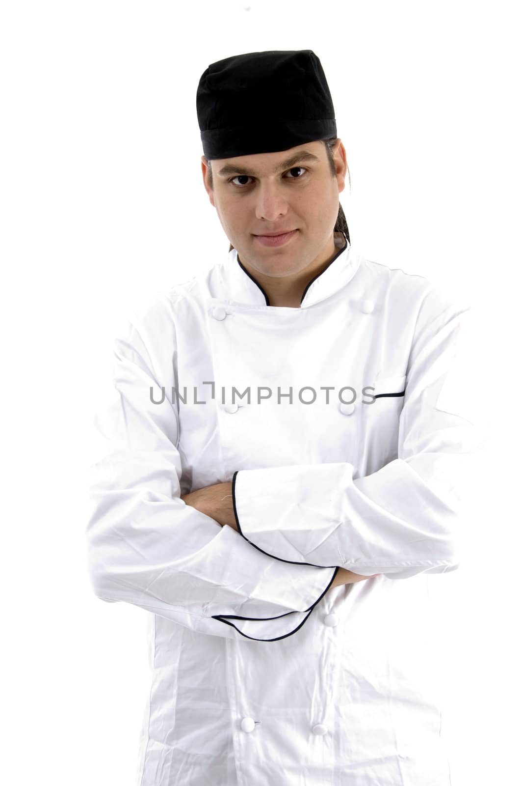 portrait of chef posing in uniform against white background