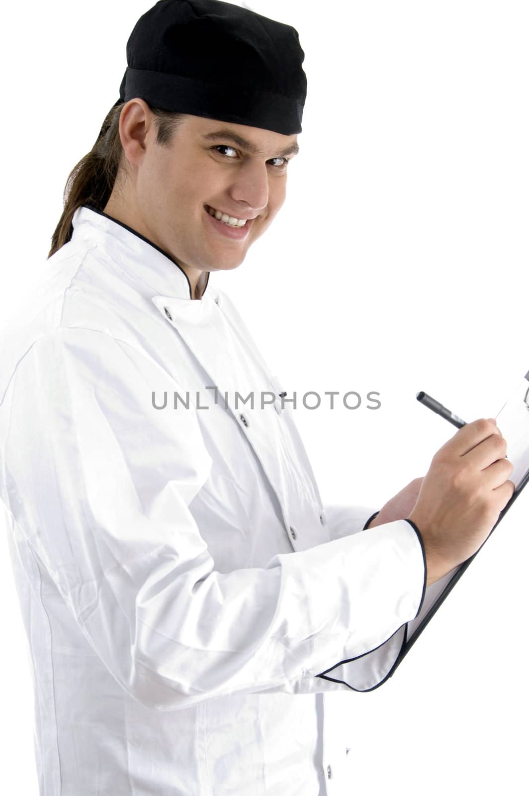 caucasian chef maintaining menu against white background