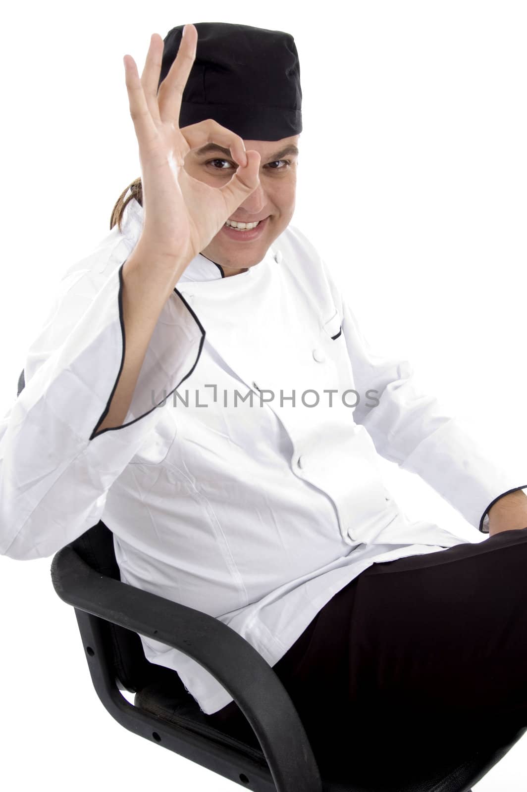 handsome chef with okay hand gesture on an isolated white background