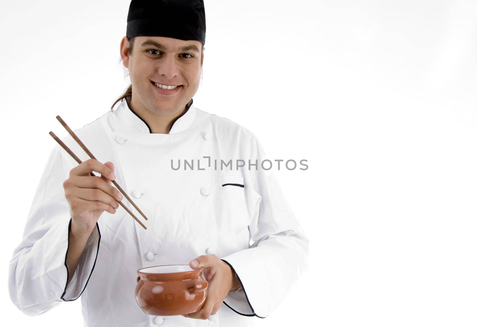 chef presenting chinese dish with chopstick against white background