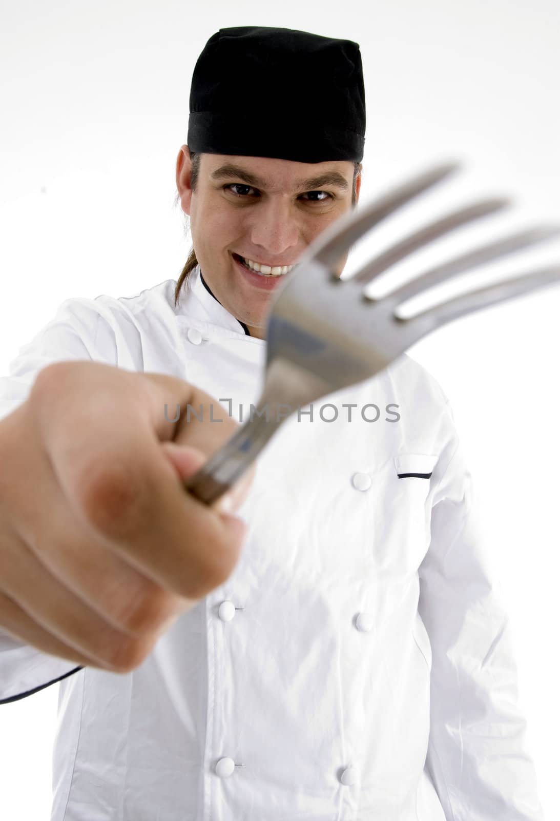 close up view of fork holding chef with white background