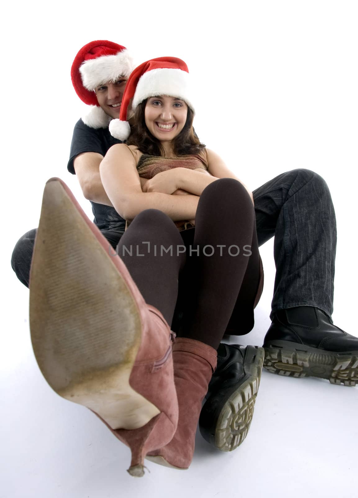 posing couple with long legs in front of camera on an isolated white background