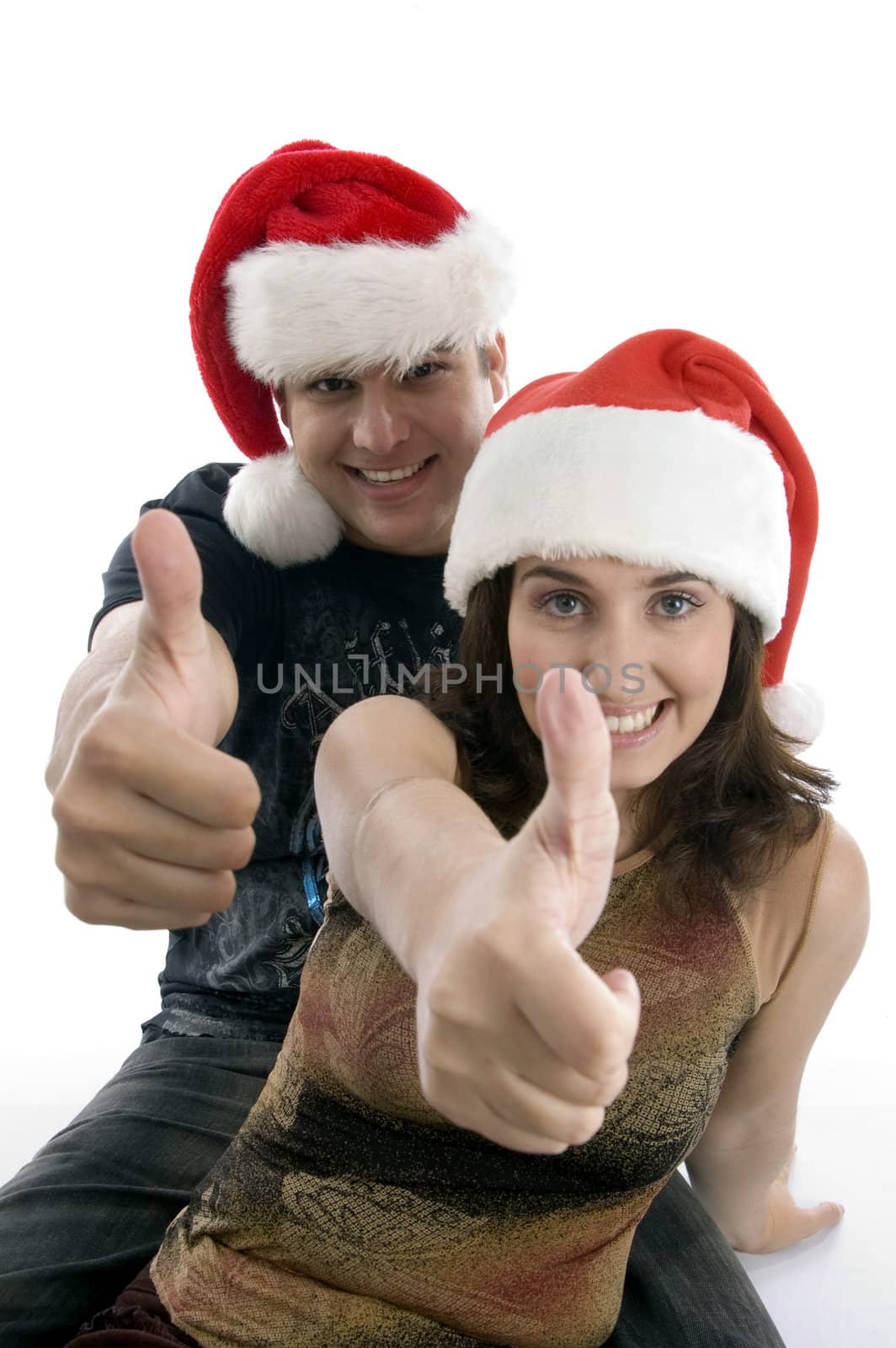 young couple wishing christmas wishes with white background