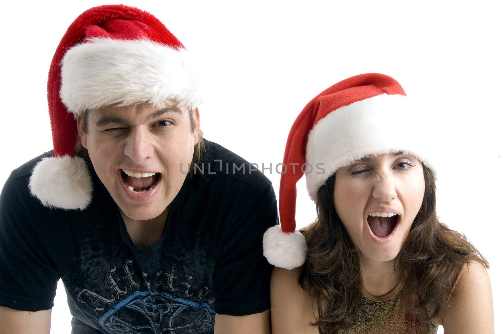 close up view of attractive couple looking at camera against white background