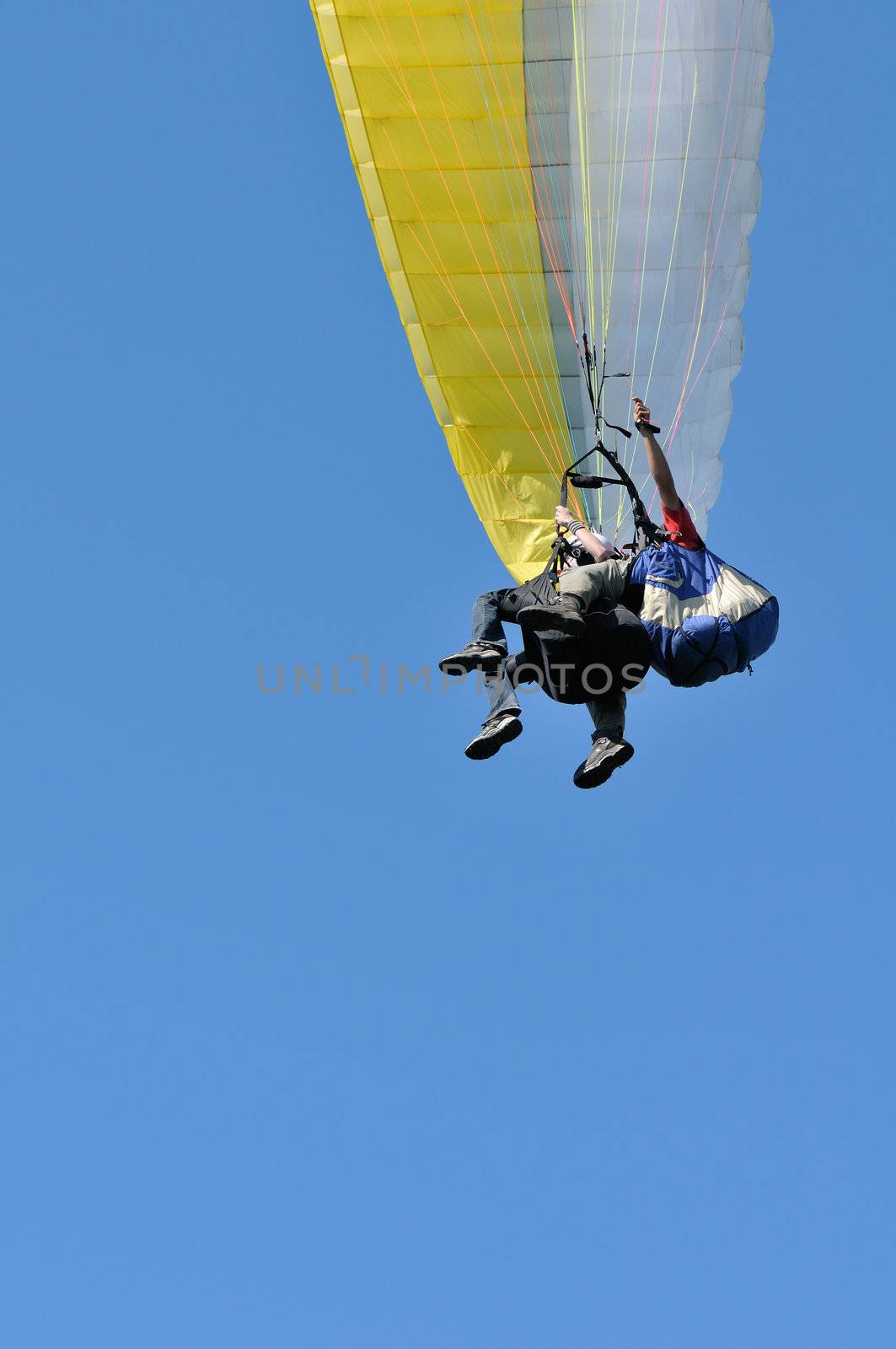 Tandem paragliders closeup with copy-space
