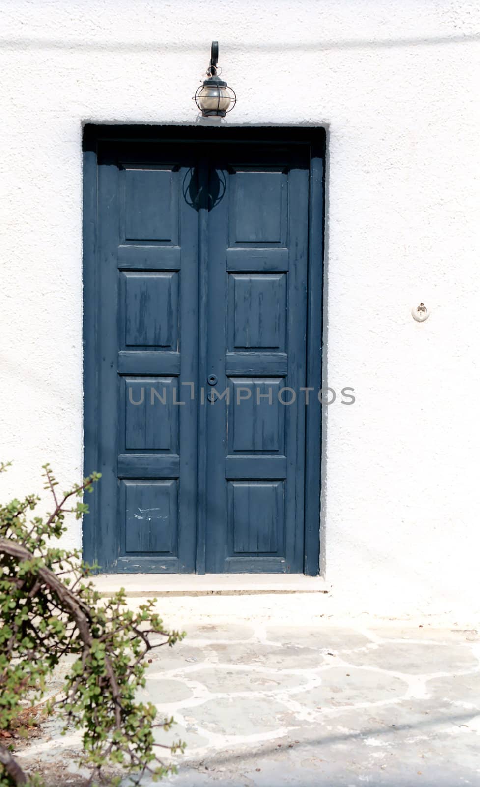 Fragment of a house with blue door