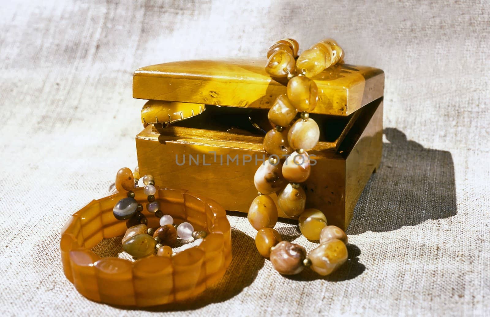  Nutwood casket and amber beads and bracelet 