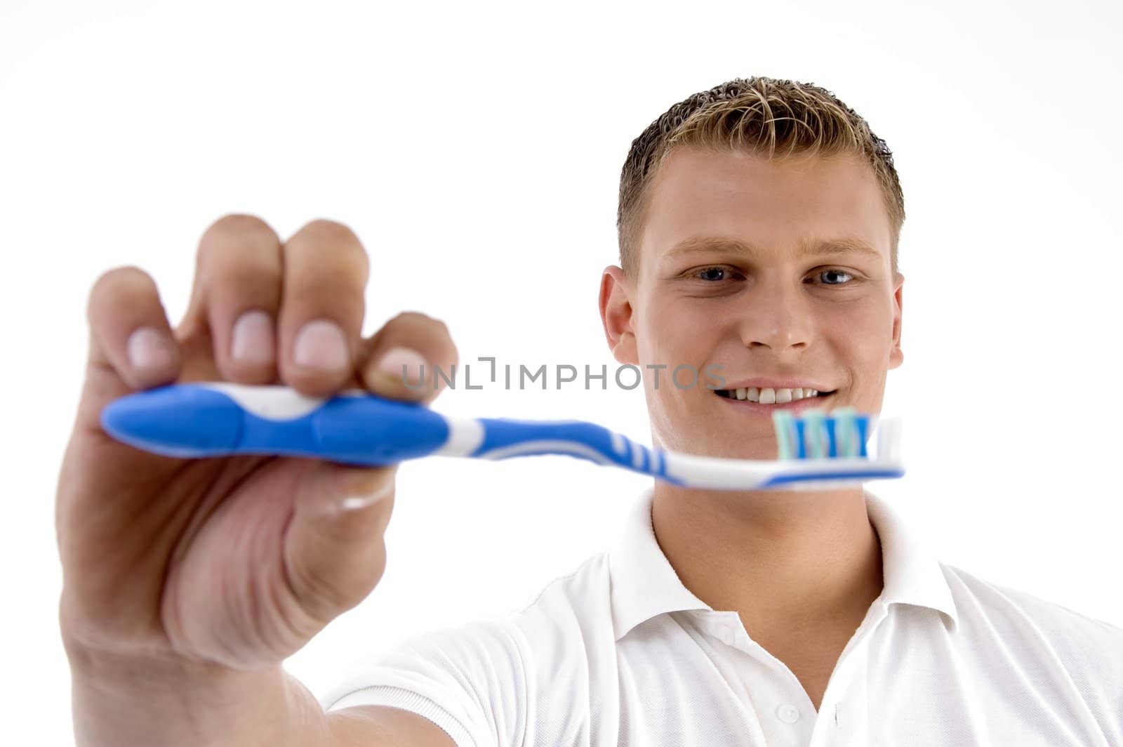 man showing his toothbrush on an isolated white background